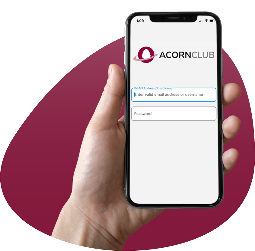 A hand holding a mobile phone with Acorn Club login page open